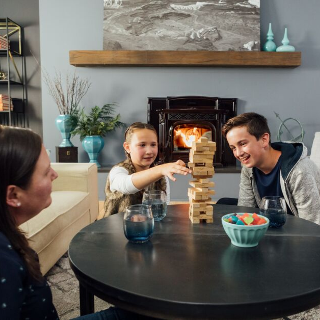 Family Game Night Around a Pellet Burning Fireplace Insert