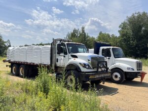 Higgins Energy Pellet Delivery Trucks Parked Outside